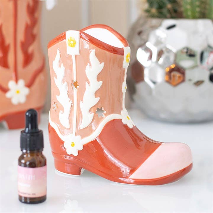 Brûleur d'huile et chauffe-cire en forme de botte de cow-boy rose