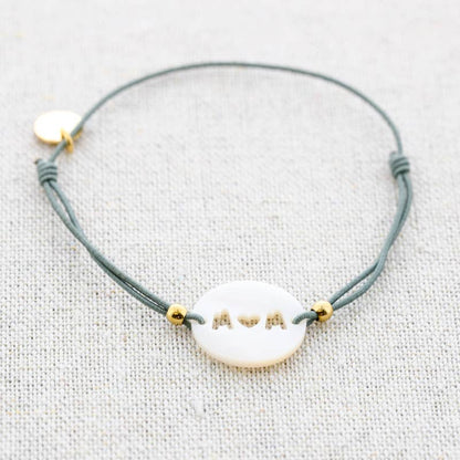 Bracelet élastique en acier avec nacre: Moutarde