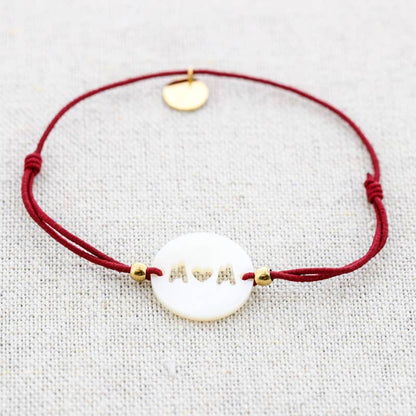 Bracelet élastique en acier avec nacre: Moutarde