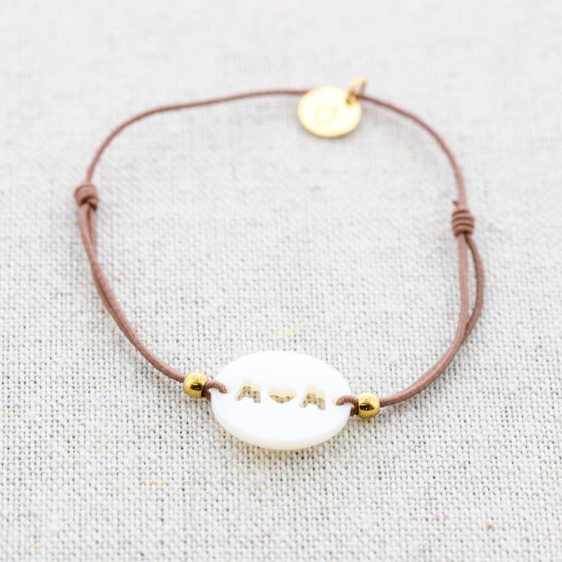 Bracelet élastique en acier avec nacre: Moutarde