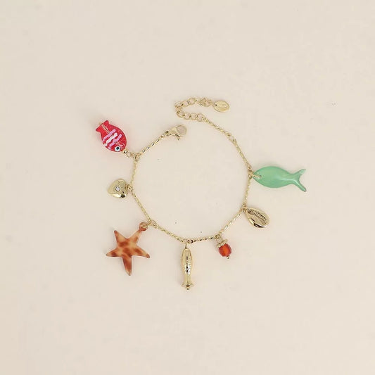 Bracelet - poissons nacré et en résine, cauri, coeur, perle