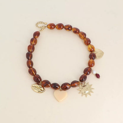 Collier sur fil - bouche, soleil, coeur, coeur en résine et pierres naturelles