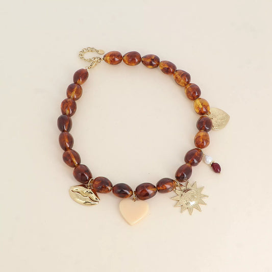 Collier sur fil - bouche, soleil, coeur, coeur en résine et pierres naturelles