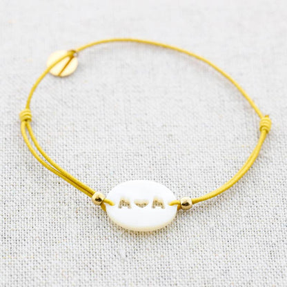 Bracelet élastique en acier avec nacre: Moutarde