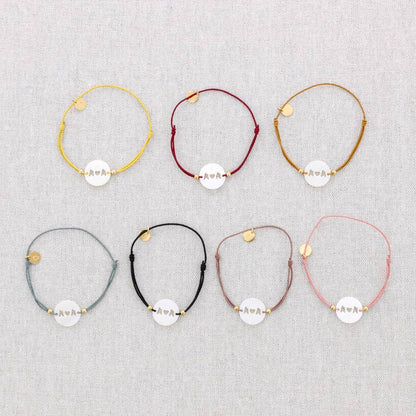 Bracelet élastique en acier avec nacre: Moutarde